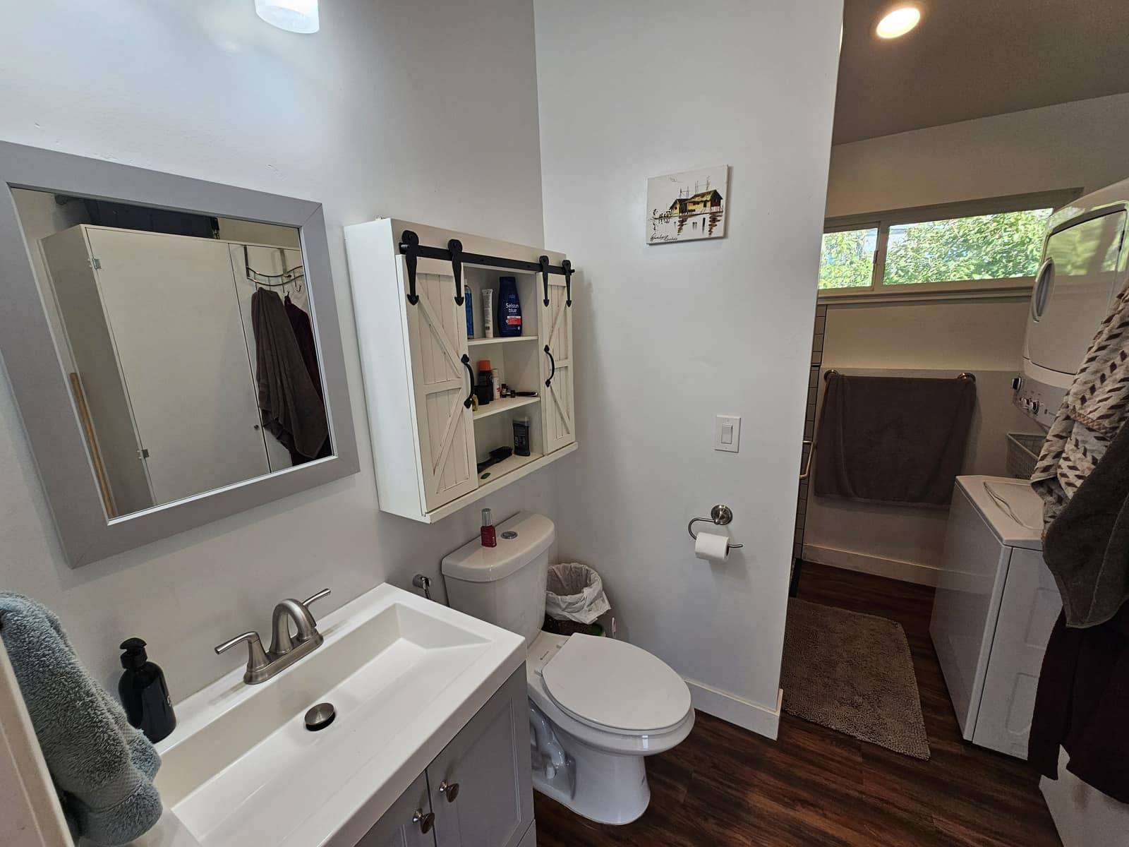 Vanity beside the stacked washer and dryer in The Den.